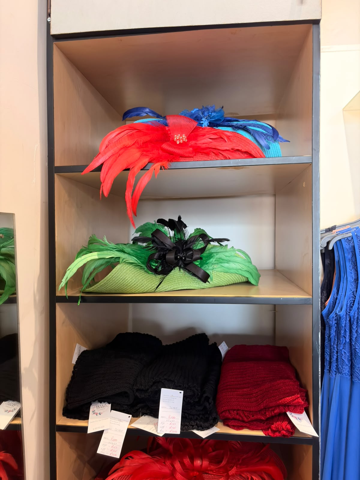 Feathered fascinators in red and green